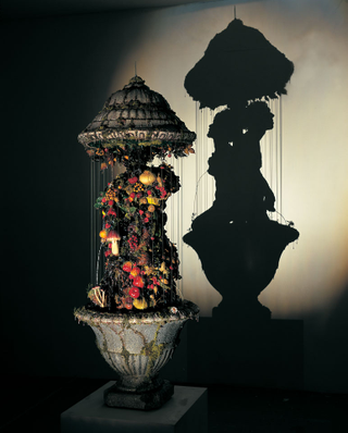 Illustration for article titled Gruesome shadow art transforms garbage and mummified rats into severed heads